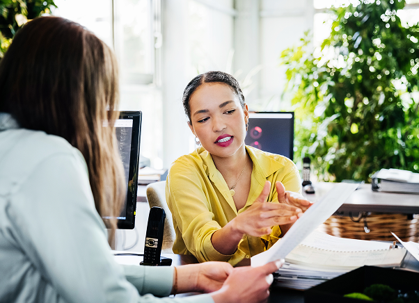Image of two colleagues discussing data