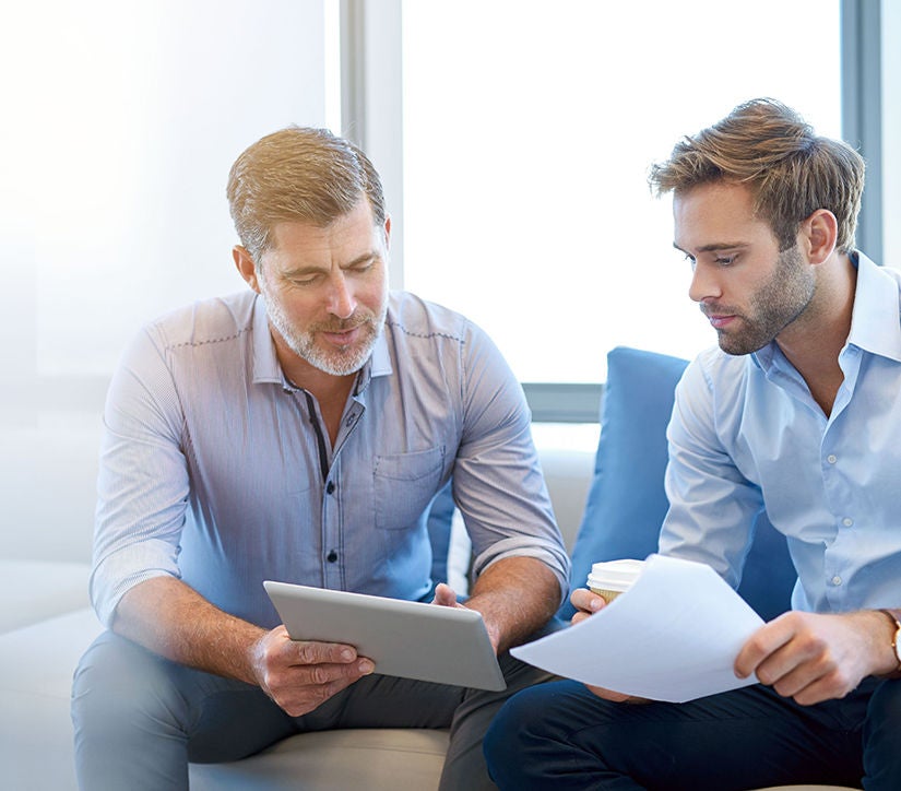 Workers discussing documents