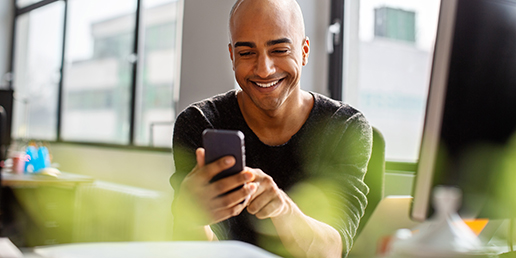Lifestyle image of man looking at phone