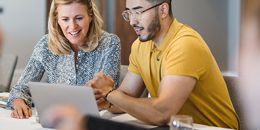 Lifestyle image of man and woman collaborating at work